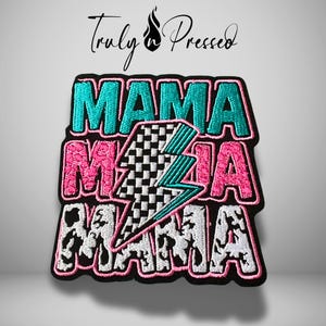 May include: Embroidered patch with the word "MAMA" in teal, pink, and white, stacked vertically. A checkered lightning bolt is in the center. The patch has a black border and the text "Truly Pressed" above.