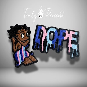May include: Two embroidered patches featuring a cartoon character with black hair wearing a blue and pink striped dress, and the word DOPE in a dripping font with blue, light blue, and pink colors. The text Truly n Pressed is visible above.