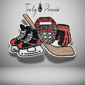 May include: Embroidered patch featuring hockey equipment: skates, a helmet, a hockey stick, and a glove. The patch has a white border and includes the text "Truly Pressed" in a script font.