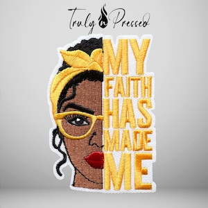 May include: An embroidered patch featuring a split design of a person with dark skin wearing a yellow headwrap and yellow glasses, with red lips. The text MY FAITH HAS MADE ME is embroidered in yellow on the right side. The brand Truly Pressed is above.