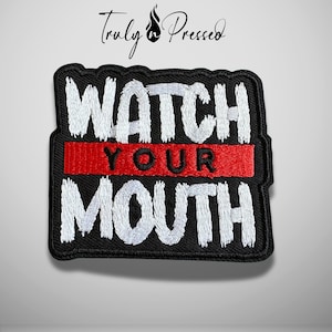 May include: A rectangular embroidered patch with a black background and a thick black border. The text WATCH and MOUTH are stitched in white thread. A horizontal red stripe runs across the center with the word YOUR stitched in black thread.