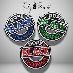 May include: Three circular embroidered patches featuring the text DOPE BLACK THERAPIST. The top left patch has blue text and stars, the top right has green text and stars, and the bottom patch has red text and stars. All have black backgrounds.