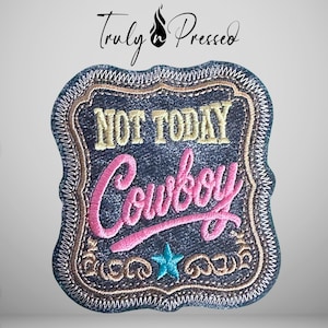May include: A rectangular embroidered patch with a dark denim-textured background and a decorative border. The text NOT TODAY is stitched in gold, while the word Cowboy is in pink script. A small teal star sits below the text.
