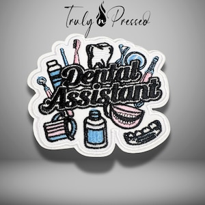May include: Embroidered patch with the words "Dental Assistant" in black script, surrounded by dental tools and a tooth. The patch has a white border and features pink and blue accents. The text "Truly Pressed" is at the top.