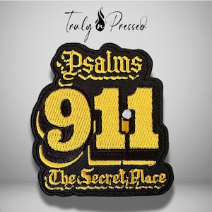 May include: An embroidered patch featuring the text Psalms 91:1 and The Secret Place in yellow thread on a black background. The numbers 911 are large and prominent, with a small white and yellow icon integrated into the number one.