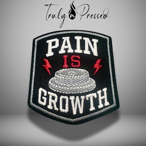 May include: Black and white embroidered patch with the words "PAIN IS GROWTH". The patch features a gray rope design and red lightning bolts. The brand name "Truly Pressed" is at the top.