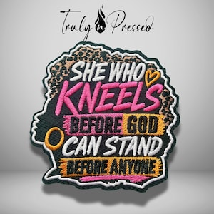 May include: An embroidered patch featuring a leopard print silhouette of a head with the text "SHE WHO KNEELS BEFORE GOD CAN STAND BEFORE ANYONE" in pink, white, black, and yellow thread. The patch includes a small yellow heart and circle icon.