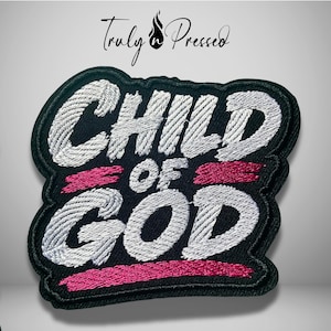 May include: A black embroidered patch featuring the white text CHILD OF GOD with pink horizontal brushstroke accents. The patch has a thick black border and a textured fabric finish. Above the patch, the text Truly Pressed is visible.