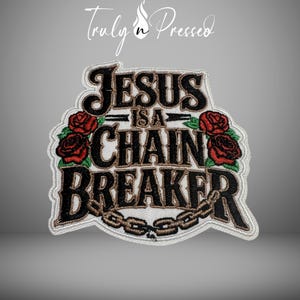 May include: Embroidered patch with the text "JESUS is a CHAIN BREAKER" in black and brown, with red roses and a chain design. The patch has a white border and the brand name "Truly n Pressed" is at the top.