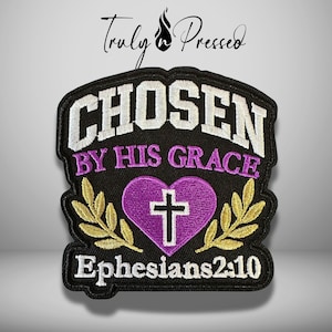 May include: A black embroidered patch featuring the white text CHOSEN, purple text BY HIS GRACE, and white text Ephesians 2:10. A purple heart with a white cross sits in the center, flanked by two gold laurel branches on a black background.