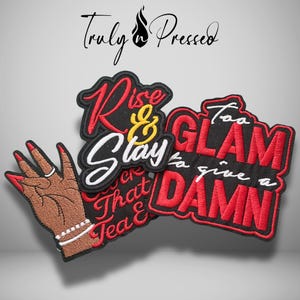 May include: Three embroidered patches featuring black, red, and white thread. One patch shows a hand with red nails, a ring, and a bracelet. Another reads Rise & Slay in red and yellow. The third reads Too GLAM to give a DAMN in red and white.