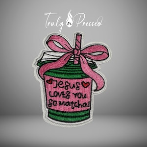 May include: Embroidered patch featuring a green and pink matcha drink with a pink bow and straw. The patch reads "Jesus loves you so matcha" in pink lettering. The patch has a white border and the words "Truly n Pressed" in the top center.