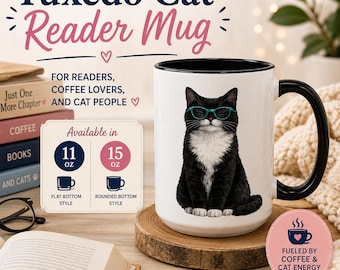 May include: A white ceramic mug with a black handle and interior, featuring a graphic of a black and white tuxedo cat wearing teal glasses. The mug displays text including Tuxedo Cat Reader Mug, Available in 11 oz and 15 oz, and Fueled by coffee & cat energy.