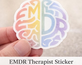May include: A round sticker with a brain design, split into two halves. One side is rainbow-colored, the other is pastel purple and blue. The sticker has the text "EMDR Therapist Sticker" and "Waterproof Vinyl".