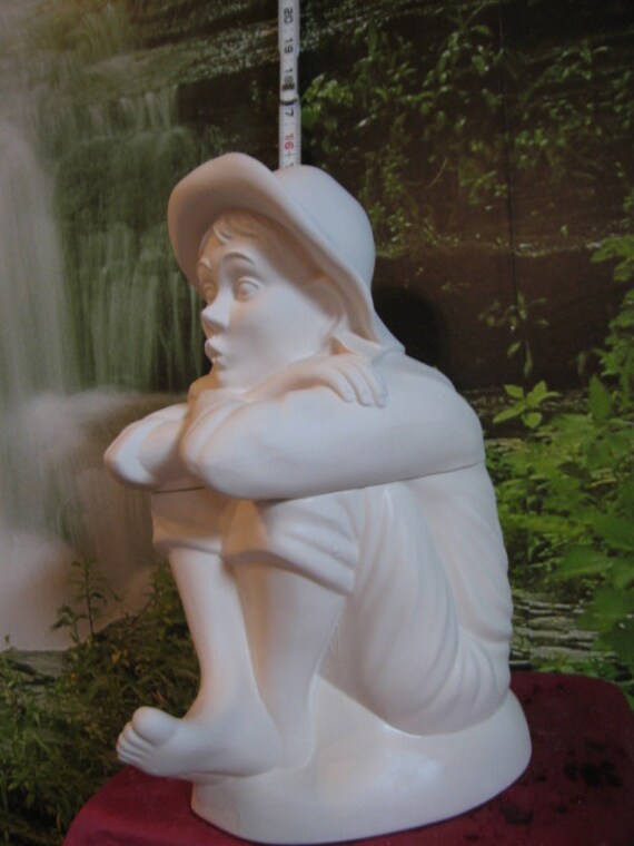 whistling boy figurine