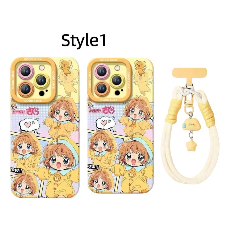 May include: Two phone cases with a cartoon illustration of a character in a yellow outfit, with the text "Good Luck" and Japanese text. A matching yellow and white phone strap with a cloud and star charm is also included.
