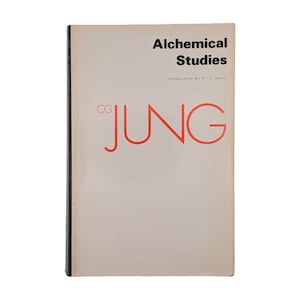 May include: A softcover book titled Alchemical Studies by C.G. Jung, translated by R.F.C. Hull. The cover is off-white with black text for the title and translator, and large, bold, red outlined letters spelling JUNG with CG in smaller red text.