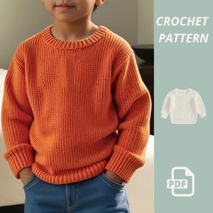 May include: An orange knitted sweater with ribbed cuffs and hem, worn by a child. The sweater is paired with blue jeans. A small white sweater and the words "CROCHET PATTERN" are in the upper right corner. A PDF icon is also present.