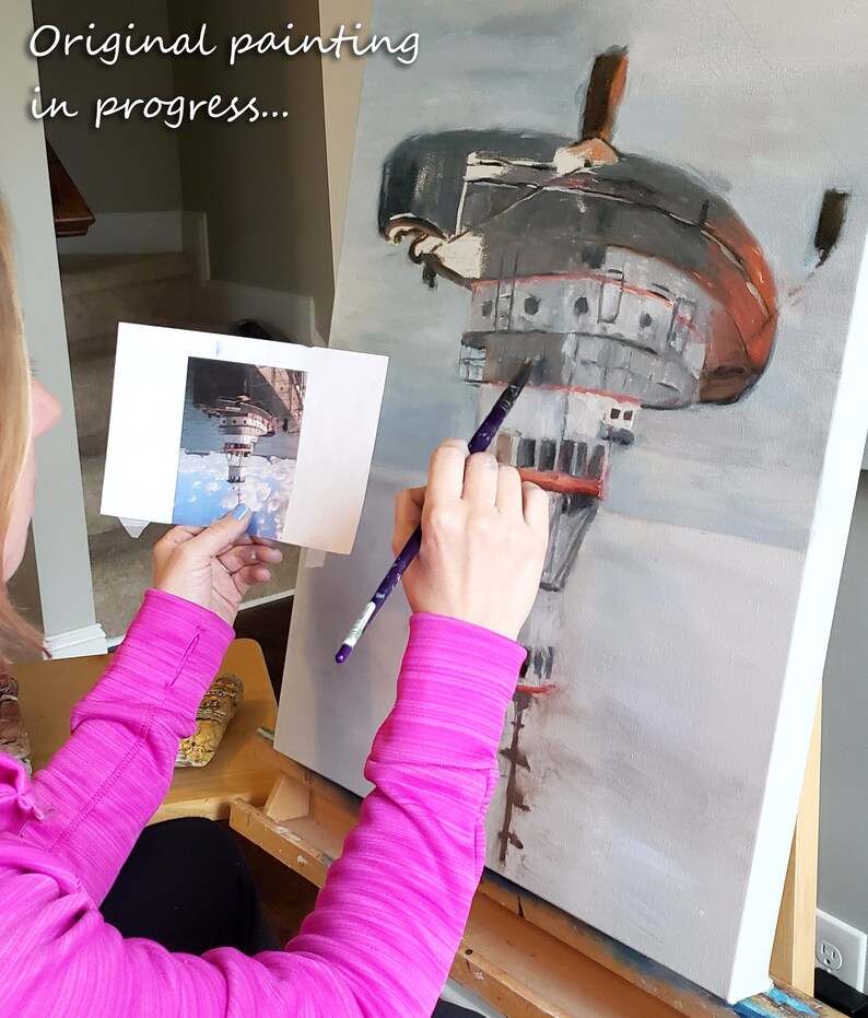 May include: A person paints a canvas with a brush. The canvas depicts a painting of a red and gray ship in the sky. The text "Original painting in progress..." is visible at the top of the canvas.