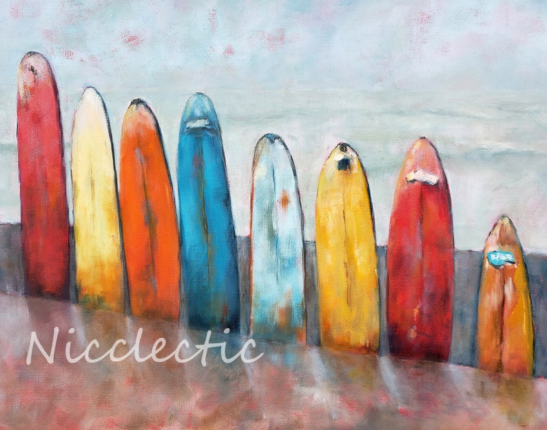 May include: A painting depicting a row of colourful surfboards lined up on a beach. The surfboards are various shades of red, orange, yellow, blue, and green. The background is a light blue sky with white clouds.