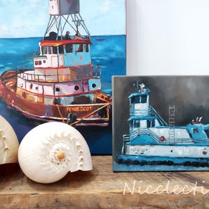 May include: Two paintings of tugboats on canvas. The larger painting shows a red, white, and blue tugboat with the name "Pendscot" on the side. The smaller painting shows a blue and white tugboat with a dark gray background.