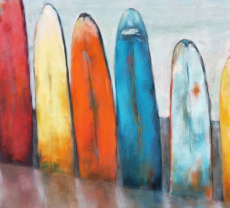 May include: A painting depicting six colourful surfboards lined up on a beach. The surfboards are painted in shades of red, yellow, orange, blue, and green.