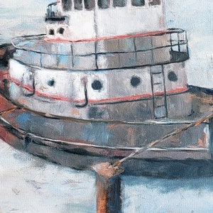 May include: A weathered tugboat is docked at a pier. The boat is painted white with red and gray accents. The boat has a ladder on the side and a rope tied to the front.
