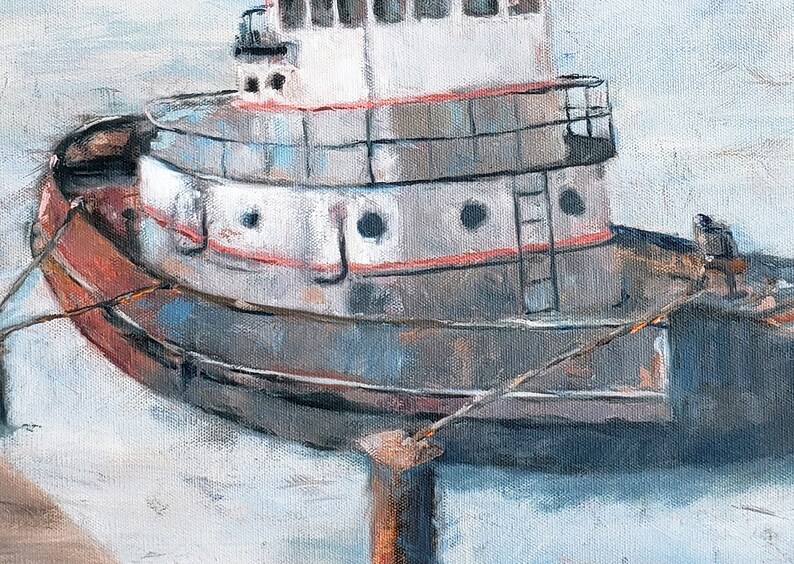 May include: A weathered tugboat is docked at a pier. The boat is painted white with red and gray accents. The boat has a ladder on the side and a rope tied to the front.