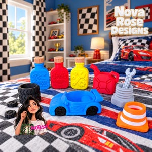 May include: A collection of colorful racing-themed silicone toys including three bottles with textured caps, a red fuel can, a blue race car, a gray wrench in a nut, a traffic cone, and black tires, all arranged on a checkered bedspread.