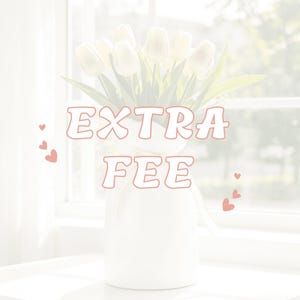 May include: A white vase holding white tulips, with the words "EXTRA FEE" in a light red font. Small red hearts are scattered around the vase. The vase is on a white surface.