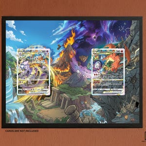 May include: A rectangular black frame containing a vibrant fantasy landscape illustration with a central volcano, waterfall, and ruins. Two rectangular slots are positioned within the artwork to display trading cards. Text reads CARDS ARE NOT INCLUDED.