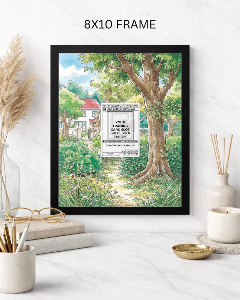 May include: An 8x10 inch framed print featuring a watercolor illustration of a path leading to a house, surrounded by trees and greenery. The frame is black, and the print includes text that reads "YOUR TRADING CARD SLOT".