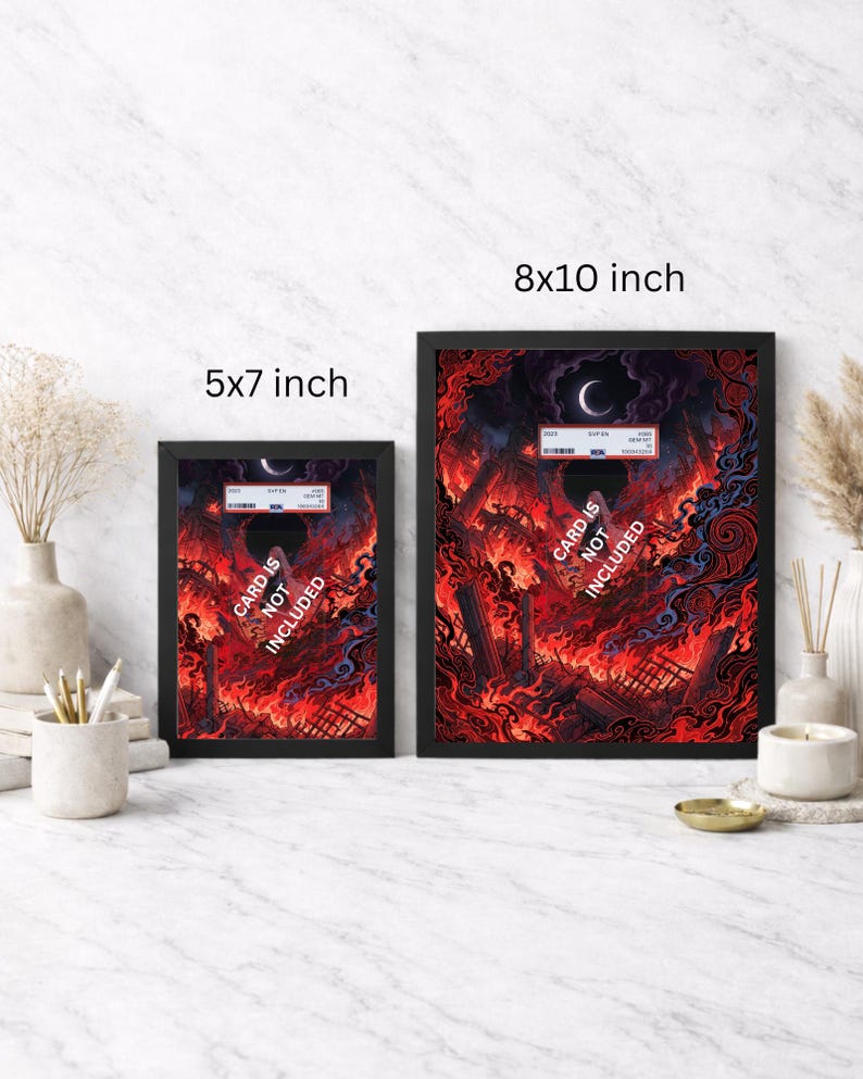 May include: Two framed art prints, one 5x7 inches and the other 8x10 inches, feature a fiery, apocalyptic scene with a crescent moon. The text "CARD IS NOT INCLUDED" is visible on both. The frames are black.