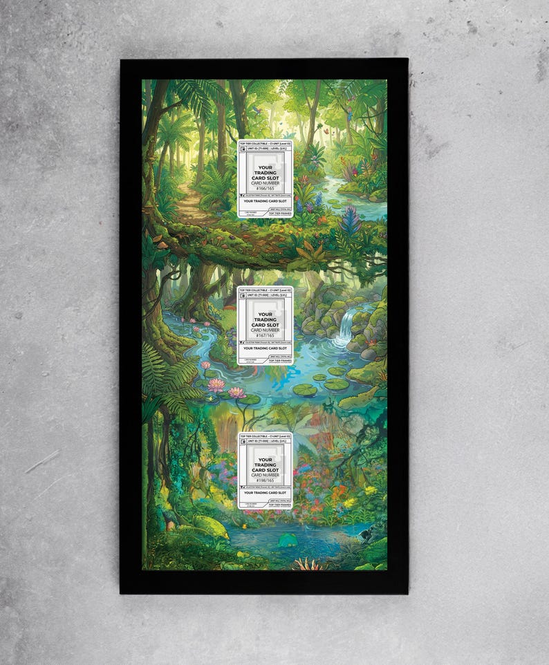 May include: A framed artwork featuring a vibrant jungle scene with a river, waterfalls, and lush greenery. Three white card slots are visible, each with the text "YOUR TRADING CARD SLOT CARD NUMBER". The artwork is encased in a black frame.
