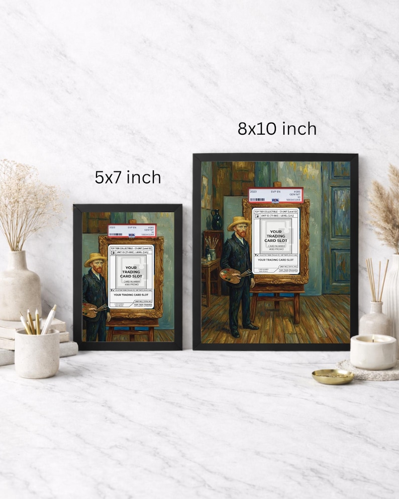May include: Two framed art prints, one 12.7 x 17.8 cm and the other 20.3 x 25.4 cm, depict a painting of a man in a straw hat holding a palette. The painting includes a trading card slot. The frames are black.