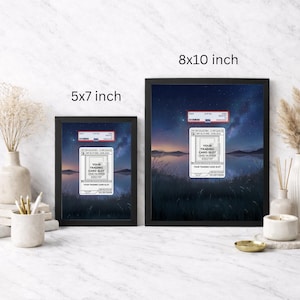 May include: Two framed prints, one 5x7 inches and the other 8x10 inches, featuring a serene landscape with a night sky and water. Each print includes a white label with the text "YOUR TRADING CARD SLOT CARD NUMBER #000/197".