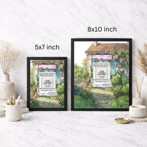 May include: Two framed art prints, one 5x7 inches and the other 8x10 inches, featuring a picturesque scene of a house with a stone path and lush greenery. Each frame is black and includes text that reads "YOUR TRADING CARD SLOT."