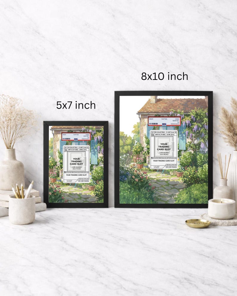 May include: Two framed art prints, one 5x7 inches and the other 8x10 inches, featuring a picturesque scene of a house with a stone path and lush greenery. Each frame is black and includes text that reads "YOUR TRADING CARD SLOT."