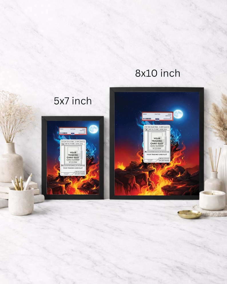 May include: Two framed art prints, 5x7 inches and 8x10 inches, feature a surreal scene with a trading card graphic. The artwork depicts a card slot with the text "YOUR TRADING CARD SLOT CARD NUMBER #125/054" set against a fiery landscape and a night sky with a full moon.