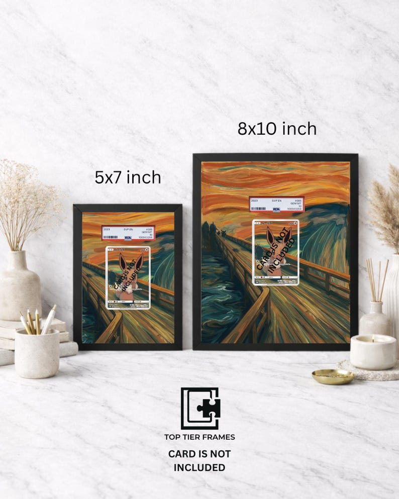 May include: Two black frames in 5x7 inch and 8x10 inch sizes, each containing a print of a bridge scene with an orange sky, featuring a central rectangular card holder with the text CARDS NOT INCLUDED. The frames are displayed on a white surface.