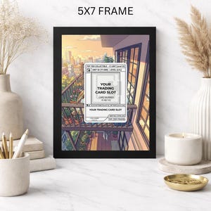 May include: A black 5x7 frame displaying a trading card slot design. The artwork features a balcony scene with a cityscape backdrop. Text includes "Your Trading Card Slot" and "Top Tier Frames."