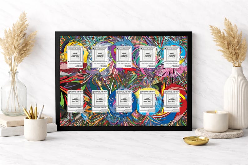 May include: A framed artwork with a black border, featuring a vibrant abstract design in various colours. The artwork includes ten white card slots with the text "YOUR TRADING CARD SLOT". Decorative elements include vases with dried plants and a lit candle.