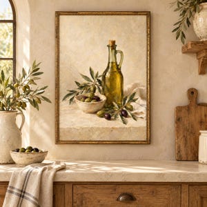 May include: A framed oil painting depicting a glass bottle filled with golden olive oil, a ceramic bowl containing green and black olives, and olive branches with leaves. The artwork features a neutral, textured background and a gold-toned frame.