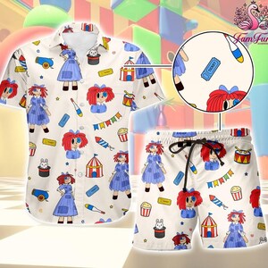 May include: A short-sleeve button-down shirt and matching shorts set in cream featuring a repeating pattern of rag dolls with red yarn hair, blue dresses, circus tents, popcorn buckets, cannons, juggling pins, tickets, and rabbits in top hats.