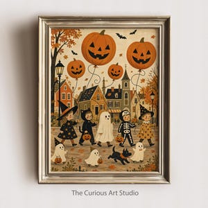 以下が含まれることがあります： The Curious Art Studioというタイトルの額入りアートプリント。ハロウィンの仮装をした子供たちが町を歩くヴィンテージ風のイラストが描かれています。カボチャのバルーン、黒い犬、秋の紅葉が描かれたシーンです。