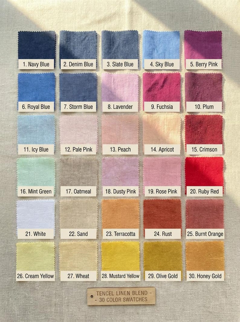 May include: A display of 30 fabric swatches in various colors, including blues, pinks, yellows, and oranges. Each swatch is labeled with a number and color name, such as "Navy Blue" and "Berry Pink." The text "TENCEL LINEN BLEND - 30 COLOR SWATCHES" is at the bottom.