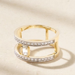 May include: A set of three ceramic mugs with a speckled, cream-colored glaze. Each mug features a different hand-painted floral design in shades of blue, green, and yellow. The mugs have a simple, rounded shape and a comfortable handle.