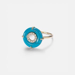 May include: A white ceramic mug with a black handle and the text "But First, Coffee" in a black, bold font. The mug is sitting on a white surface. The mug appears to be 12 ounces.