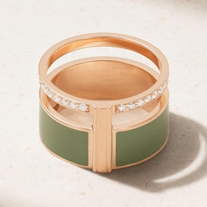 May include: A rose gold ring with a green enamel band and a top band encrusted with small, clear gemstones. The ring has a unique, layered design with a vertical gold accent.