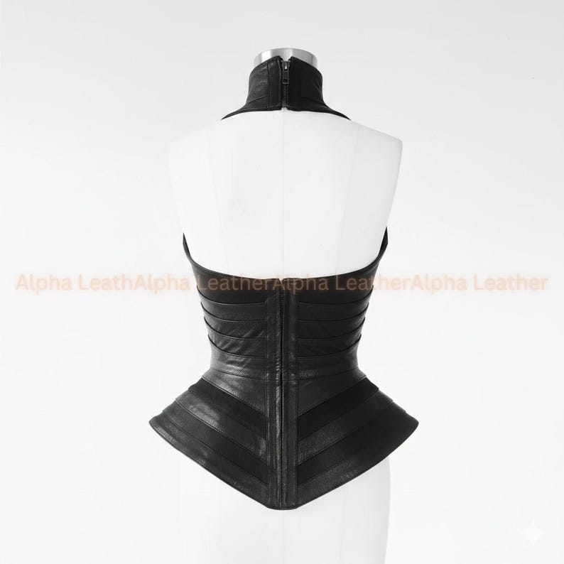 May include: Black leather corset with a high collar and a zipper closure. The corset features a structured design with horizontal and diagonal panels, creating a fitted silhouette. The garment is displayed on a white mannequin.